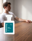 hideaway. Kings Conquest perfume 50ml bottle on a walnut desk in warm daylight