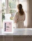 hideaway. Smoke & Sugar perfume 50ml bottle on a marble ledge by a sunlit window