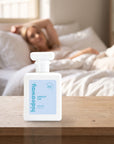 hideaway. Amalfi Air perfume 50ml bottle on a bedside table in warm morning light
