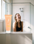 hideaway. Pineapple Coconut Hair Mask on a shower ledge in a bright bathroom