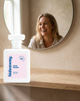 hideaway. Love Drunk perfume 50ml bottle on an oak shelf below a round mirror