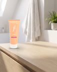 hideaway. Aurora Rouge Hair Mask on a pale timber vanity top in a bright bathroom