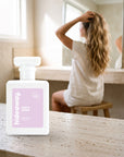 hideaway. Rise & Shine perfume 50ml bottle on a travertine vanity while she gets ready in the morning