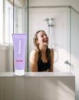 hideaway. Aurora Rouge Body Wash on a shower ledge in a bright bathroom