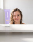 hideaway. Vanilla Caramel Body Wash on a white shelf in a bright tiled bathroom