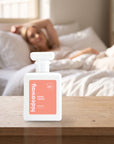 hideaway. Fairy Tears perfume 50ml bottle on a bedside table in warm morning light
