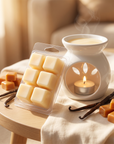 Vanilla Caramel wax melts and a lit burner styled on a side table with vanilla pods and caramel