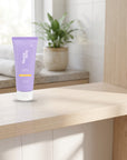 hideaway. Pineapple Coconut Body Scrub on a timber bathroom shelf beside rolled towels