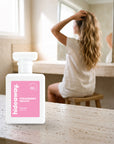 hideaway. Strawberry Gelato perfume 50ml bottle on a travertine vanity while she gets ready in the morning
