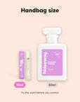 hideaway. Elegant Charm perfume 10ml travel size beside the 50ml bottle, handbag size