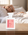 hideaway. City Of Love perfume 50ml bottle on a bedside table in warm morning light