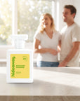 hideaway. Pistachio Paradise perfume 50ml bottle on a stone benchtop in a bright kitchen