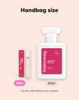 hideaway. Aurora Rouge perfume 10ml travel size beside the 50ml bottle, handbag size