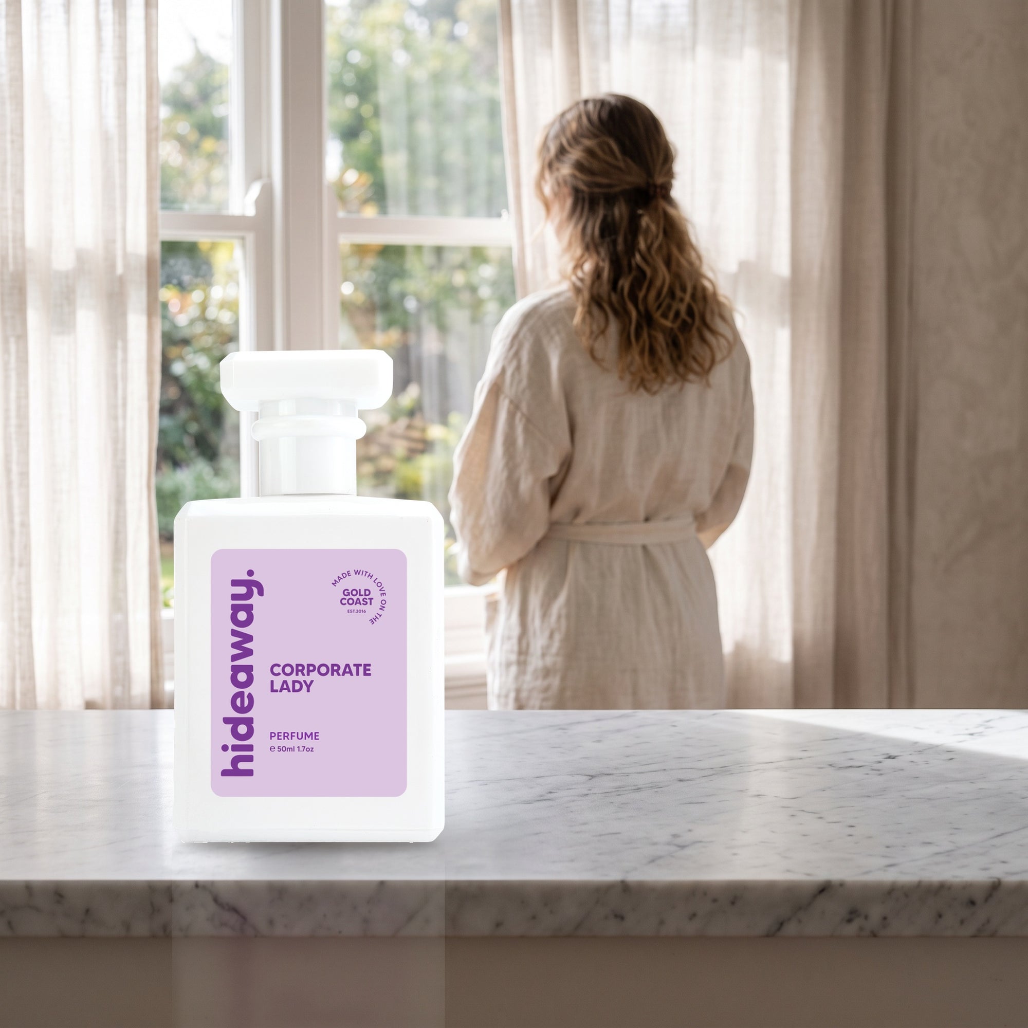 hideaway. Corporate Lady perfume 50ml bottle on a marble ledge by a sunlit window