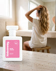 hideaway. Musk Sticks perfume 50ml bottle on a travertine vanity while she gets ready in the morning