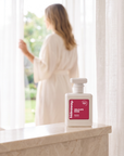 hideaway. Delicate Rose perfume 50ml bottle on a marble ledge by a sunlit window
