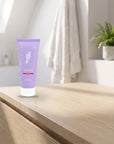hideaway. Mini Aurora Rouge Shower Mousse on a pale timber vanity top in a bright bathroom