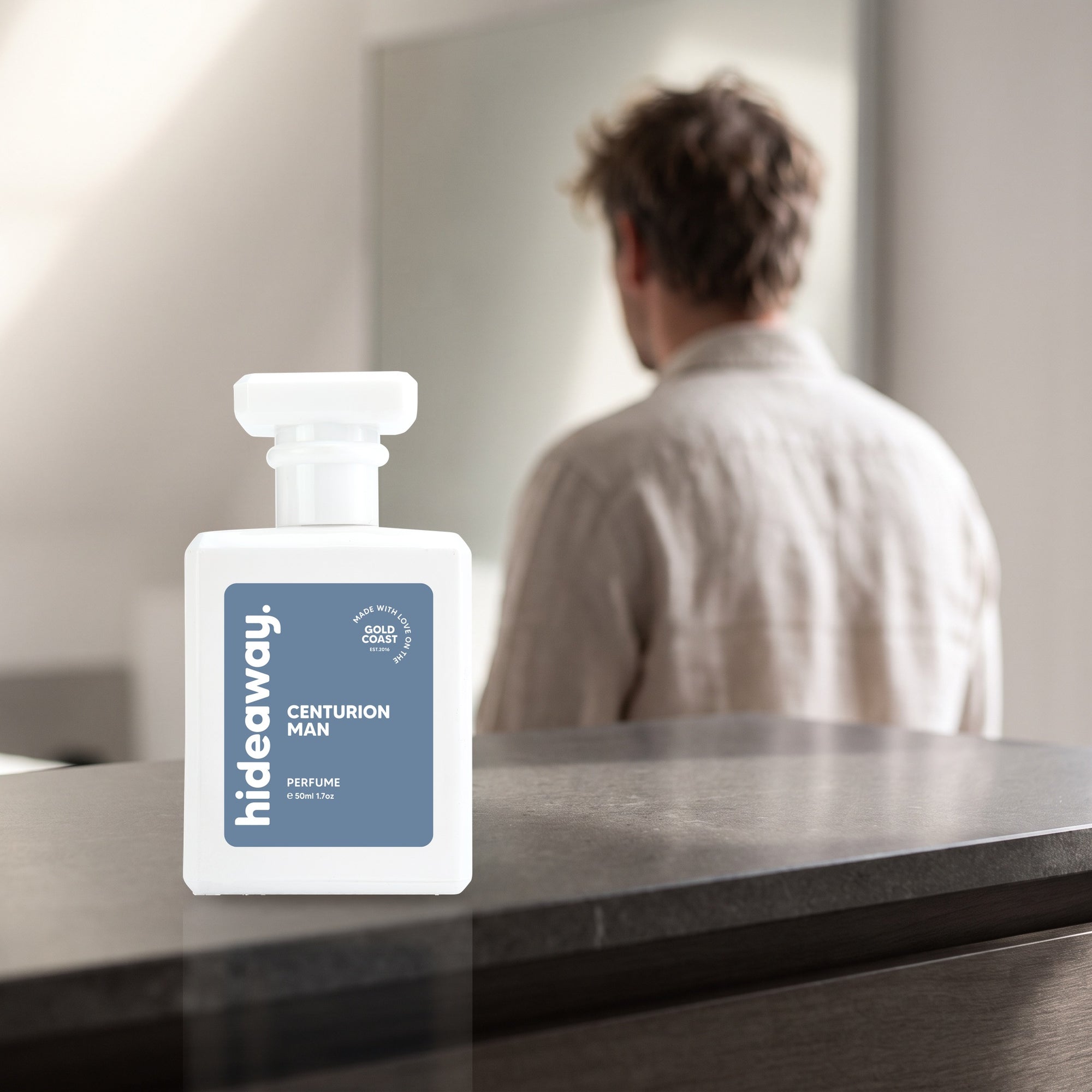 hideaway. Centurion Man perfume 50ml bottle on a stone dresser in soft morning light