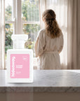 hideaway. Flower Power perfume 50ml bottle on a marble ledge by a sunlit window