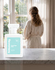 hideaway. Diamond Kiss perfume 50ml bottle on a marble ledge by a sunlit window