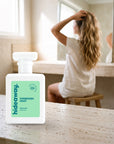 hideaway. Forbidden Fruit perfume 50ml bottle on a travertine vanity while she gets ready in the morning