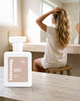 hideaway. Vanilla Delight perfume 50ml bottle on a travertine vanity while she gets ready in the morning