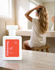 hideaway. Alter Ego perfume 50ml bottle on a travertine vanity while she gets ready in the morning